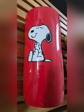 Red drinkware, iconic Peanuts character, Snoopy, classic